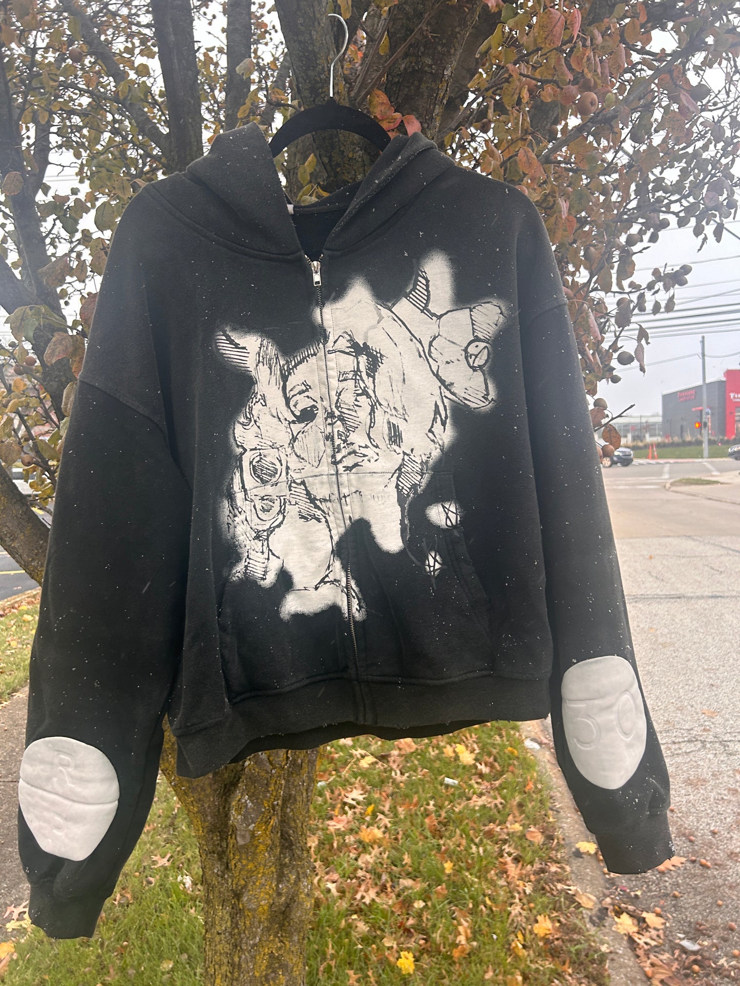 “FIGHTING DEMONS” cropped zip-up